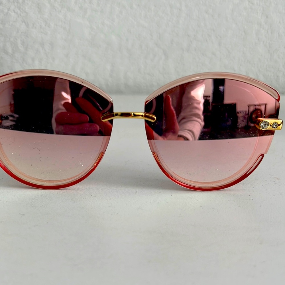 Pink mirror with gold accent sunglasses